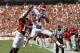 DALLAS, TX - OCTOBER 8: Kenny Stills #4 of the Oklahoma Sooners catches a touchdown pass over Adrian Phillips #17 of the Texas Longhorns at the Cotton Bowl on October 8, 2011 in Dallas, Texas. The Sooners defeated the Longhorns 55 to 17. (Photo by Wesley Hitt/Getty Images)