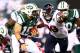 EAST RUTHERFORD, NJ - OCTOBER 08: Tim Tebow #15 of the New York Jets runs the ball against J.J. Watt #99 of the Houston Texans at MetLife Stadium on October 8, 2012 in East Rutherford, New Jersey. (Photo by Al Bello/Getty Images)
