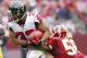 October 7, 2012; Landover, MD, USA; Atlanta Falcons running back Michael Turner (33) runs with the ball as Washington Redskins inside linebacker Perry Riley (56) attempts to make the tackle at FedEx Field. Mandatory Credit: Geoff Burke-US PRESSWIRE