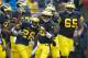 ANN ARBOR, MI - OCTOBER 13: Fitzgerald Toussaint #28 of the Michigan Wolverines celebrates a third quarter touchdown with Denard Robinson #16 and the rest of his offensive teammates while playing the Illinois Fighting Illini at Michigan Stadium on October 13, 2012 in Ann Arbor, Michigan. Michigan won the game 45-0. (Photo by Gregory Shamus/Getty Images)