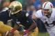 SOUTH BEND, IN - OCTOBER 13: Everett Golson #5 of the Notre Dame Fighting Irish tries to avoid the rush by Chase Thomas #44 of the Standford Cardinal at Notre Dame Stadium on October 13, 2012 in South Bend, Indiana. (Photo by Jonathan Daniel/Getty Images)