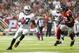 Oct 14, 2012; Atlanta, GA, USA; Oakland Raiders wide receiver Denarius Moore (17) makes his way around Atlanta Falcons middle linebacker Akeem Dent (52) during the first half at the Georgia Dome. Mandatory Credit: Josh D. Weiss-US PRESSWIRE