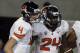 September 29, 2012; Tucson, AZ, USA; Oregon State Beavers quarterback Sean Mannion (4) and running back Storm Woods (24) celebrate after Woods scored a touchdown against the Arizona Wildcats in the third quarter at Arizona Stadium. Mandatory Credit: Rick Scuteri-US PRESSWIRE