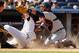 NEW YORK, NY - APRIL 29: Chris Stewart #19 of the New York Yankees slides safely under the tag of Gerald Laird #9 of the Detroit Tigers at Yankee Stadium on April 29, 2012 in the Bronx borough of New York City. Yankees defeated the Tigers 6-2. (Photo by Mike Stobe/Getty Images)