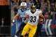 NASHVILLE, TN - OCTOBER 11: Isaac Redman #33 of the Pittsburgh Steelers rushes past Colin McCarthy #52 of the Tennessee Titans at LP Field on October 11, 2012 in Nashville, Tennessee. (Photo by Frederick Breedon/Getty Images)