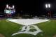 DETROIT, MI - OCTOBER 17: Members of the grounds crew put the tarp on the infield due to a weather delay for impending inclement weather prior to game four of the American League Championship Series between the Detroit Tigers and the New York Yankees at Comerica Park on October 17, 2012 in Detroit, Michigan. (Photo by Gregory Shamus/Getty Images)