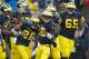 ANN ARBOR, MI - OCTOBER 13: Fitzgerald Toussaint #28 of the Michigan Wolverines celebrates a third quarter touchdown with Denard Robinson #16 and the rest of his offensive teammates while playing the Illinois Fighting Illini at Michigan Stadium on October 13, 2012 in Ann Arbor, Michigan. Michigan won the game 45-0. (Photo by Gregory Shamus/Getty Images)
