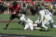 Oct 13, 2012; Lubbock, TX, USA; Texas Tech Red Raiders tight end Jace Amaro (22) is tackled by West Virginia Mountineers safety Darwin Cook (25) in the second half at Jones AT&T Stadium. Mandatory Credit: Michael C. Johnson-US PRESSWIRE