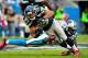 CHARLOTTE, NC - OCTOBER 07: Doug Baldwin #89 of the Seattle Seahawks makes a first-down catch as Josh Norman #24 of the Carolina Panthers defends during play at Bank of America Stadium on October 7, 2012 in Charlotte, North Carolina. (Photo by Grant Halverson/Getty Images)