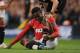 MANCHESTER, ENGLAND - APRIL 30: Danny Welbeck of Manchester United sits injured after being fouled by Nigel De Jong of Manchester City as team mate Ryan Giggs and referee Andre Marriner look on during the Barclays Premier League match between Manchester City and Manchester United at Etihad Stadium on April 30, 2012 in Manchester, England. (Photo by Michael Regan/Getty Images)