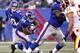 EAST RUTHERFORD, NJ - DECEMBER 18: Eli Manning #10 of the New York Giants hands off to Ahmad Bradshaw #44 of the New York Giants against the Washington Redskins during their game at MetLife Stadium on December 18, 2011 in East Rutherford, New Jersey. (Photo by Jeff Zelevansky/Getty Images)