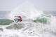 HUNTINGTON BEACH, CA - JULY 24: Julian Wilson (AUS) turns off the top frontside in Heat 7 of the Men's Round of 24 during the 2009 Hurley U.S. Open of Surfing on July 24, 2009 in Huntington Beach, California. (Photo by Victor Decolongon/Getty Images)