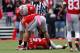 COLUMBUS, OH - OCTOBER 20: Devin Smith #15 and Jake Stoneburner #11, check on Braxton Miller #5, all of the Ohio State Buckeyes, after Miller was injured while running the ball during the fourth quarter against the Purdue Boilermakers on October 20, 2012 at Ohio Stadium in Columbus, Ohio. Miller did not return to the game.(Photo by Kirk Irwin/Getty Images)
