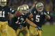 SOUTH BEND, IN - OCTOBER 20: Danny Spond #13 of the Notre Dame Fighting Irish celebrates with teammates including Manti T'eo #5 after intercepting a pass on the next to last play of the game against the BYU Cougars at Notre Dame Stadium on October 20, 2012 in South Bend, Indiana. Notre Dame defeated BYU 17-14. (Photo by Jonathan Daniel/Getty Images)
