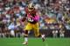 LANDOVER, MD - OCTOBER 14: Robert Griffen III #10 of the Washington Redskins runs the ball against the Minnesota Vikings at FedExField on October 14, 2012 in Landover, Maryland. The Redskins defeated the Vikings 38-26. (Photo by Larry French/Getty Images)