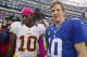 Oct 21, 2012; East Rutherford, NJ, USA; New York Giants quarterback Eli Manning (10) (right) meets Washington Redskins quarterback Robert Griffin III (10) (left) after the New York Giants 27-23, come-from-behind win over the Washington Redskins at MetLife Stadium. Mandatory Credit: Andrew Mills/THE STAR-LEDGER via US PRESSWIRE