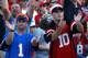 JACKSONVILLE, FL - OCTOBER 31: A fan of the Florida Gators and a fan of the Georgia Bulldogs cheer beside one another at Jacksonville Municipal Stadium on October 31, 2009 in Jacksonville, Florida. (Photo by Kevin C. Cox/Getty Images)