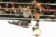 Ryback stands tall over a fallen CM Punk and Paul Heyman.