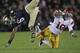 SOUTH BEND, IN - OCTOBER 22: Hayes Pullard #10 of the University of Southern California Trojans upends Theo Riddick #6 of the Notre Dame Fighting Irish at Notre Dame Stadium on October 22, 2011 in South Bend, Indiana. USC defeated Notre Dame 31-17. (Photo by Jonathan Daniel/Getty Images)