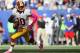 EAST RUTHERFORD, NJ - OCTOBER 21: Quarterback Robert Griffin III #10 of the Washington Redskins drops back to pass against the New York Giants at MetLife Stadium on October 21, 2012 in East Rutherford, New Jersey. (Photo by Alex Trautwig/Getty Images)
