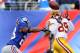 EAST RUTHERFORD, NJ - OCTOBER 21: Wide receiver Santana Moss #89 of the Washington Redskins makes a catch in the fourth quarter as cornerback Jayron Hosley #28 of the New York Giants defends during their game at MetLife Stadium on October 21, 2012 in East Rutherford, New Jersey. (Photo by Alex Trautwig/Getty Images)