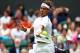 LONDON, ENGLAND - JUNE 26: Rafael Nadal of Spain hits a forehand return during his Gentlemen's Singles first round match against Thomaz Bellucci of Brazil on day two of the Wimbledon Lawn Tennis Championships at the All England Lawn Tennis and Croquet Club on June 26, 2012 in London, England. (Photo by Clive Brunskill/Getty Images)