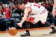 Oct 12, 2012; Champaign, IL, USA; Chicago Bulls guard Kirk Hinrich (12) tries to keep the ball in bounds during the fourth quarter against the Cleveland Cavaliers at Assembly Hall. Mandatory Credit: Bradley Leeb-US PRESSWIRE