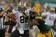 GREEN BAY, WI - SEPTEMBER 30: Jimmy Graham #80 of the New Orleans Saints fights off Tramon Williams #38 of the Green Bay Packers at Lambeau Field on September 30, 2012 in Green Bay, Wisconsin. The Packers defeated the Saints 28-27. (Photo by Jonathan Daniel/Getty Images)