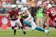 GLENDALE, AZ - SEPTEMBER 30: Wide receiver Brian Hartline #82 of the Miami Dolphins runs with the football after a reception against cornerback Jamell Fleming #23 of the Arizona Cardinals during the NFL game at the University of Phoenix Stadium on September 30, 2012 in Glendale, Arizona. The Carindals defeated the Dolphins 24-21 in overtime. (Photo by Christian Petersen/Getty Images)