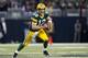 ST. LOUIS, MO - OCTOBER 21: Quarterback Aaron Rodgers #12 of the Green Bay Packers looks to pass while running to the outside during the game against St. Louis Rams at the Edward Jones Dome on October 21, 2012 in St. Louis, Missouri. (Photo by David Welker/Getty Images)