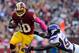 LANDOVER, MD - OCTOBER 14: Robert Griffin III #10 of the Washington Redskins is tackled by Erin Henderson #50 of the Minnesota Vikings during the first half at FedExField on October 14, 2012 in Landover, Maryland. (Photo by Patrick McDermott/Getty Images)