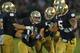 SOUTH BEND, IN - OCTOBER 20: Danny Spond #13 of the Notre Dame Fighting Irish celebrates with teammates including Ishaq Williams #11 and Manti T'eo #5 after intercepting a pass on the next to last play of the game against the BYU Cougars at Notre Dame Stadium on October 20, 2012 in South Bend, Indiana. Notre Dame defeated BYU 17-14. (Photo by Jonathan Daniel/Getty Images)