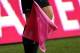 HARRISON, NJ - OCTOBER 06: An official holds a pink flag for breast cancer awareness during a match between the Chicago Fire and the New York Red Bulls at Red Bull Arena on October 6, 2012 in Harrison, New Jersey. (Photo by Jeff Zelevansky/Getty Images)