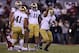 Oct 27, 2012; Norman, OK, USA; Notre Dame Fighting Irish linebacker Manti Te'o (5) celebrates an interception in the fourth quarter against Oklahoma Sooners receiver Lacoltan Bester (18) at Oklahoma Memorial Stadium. The Irish beat the Sooners 30-13. Mandatory Credit: Matthew Emmons-US PRESSWIRE