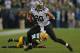 GREEN BAY, WI - SEPTEMBER 30: Jimmy Graham #80 of the New Orleans Saints moves around Charles Woodson #21 of the Green Bay Packers at Lambeau Field on September 30, 2012 in Green Bay, Wisconsin. The Packers defeated the Saints 28-27. (Photo by Jonathan Daniel/Getty Images)