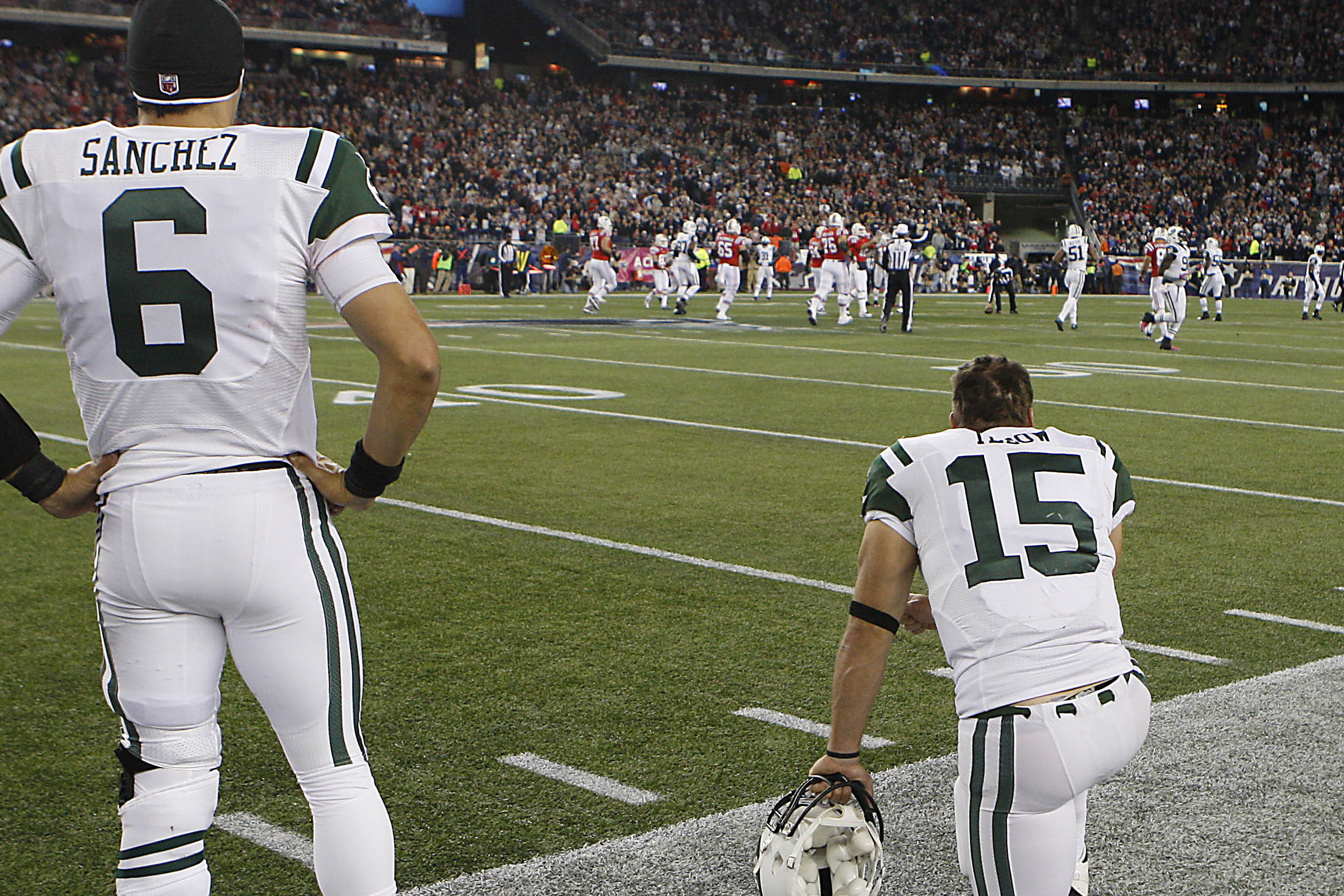 New York Jets Tim Tebow and Mark Sanchez warm up on the field before the  game against the New York Giants in a Pre Season NFL game at MetLife  Stadium in East