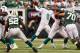 EAST RUTHERFORD, NJ - OCTOBER 28: Quarterback Matt Moore #8 of the Miami Dolphins drops back to pass against the New York Jets at MetLife Stadium on October 28, 2012 in East Rutherford, New Jersey. (Photo by Alex Trautwig/Getty Images)