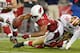 GLENDALE, AZ - OCTOBER 29: Receiver Larry Fitzgerald #11 of the Arizona Cardinals is stopped short of the endzone by Perrish Cox #20 and Dashon Goldson #38 of the San Francisco 49ers during the fourth quarter of an NFL game at University of Phoenix Stadium on October 29, 2012 in Glendale, Arizona. (Photo by Ralph Freso/Getty Images)