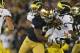 SOUTH BEND, IN - SEPTEMBER 22: Prince Shembo #55 of the Notre Dame Fighting Irish hits Denard Robinson #16 of the Michigan Wolverines at Notre Dame Stadium on September 22, 2012 in South Bend, Indiana. Notre Dame defeated Michigan 13-6. (Photo by Jonathan Daniel/Getty Images)