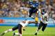 NASHVILLE, TN - AUGUST 27: Ahmard Hall #45 of the Tennessee Titans hurdles Tim Jennings #26 and Israel Idonije #71 of the Chicago Bears during a preseason game at LP Field on August 27, 2011 in Nashville, Tennessee. (Photo by Grant Halverson/Getty Images)