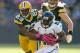 GREEN BAY, WI - OCTOBER 28: Casey Hayward #29 of the Green Bay Packers tackles Mike Thomas #80 of the Jacksonville Jaguars during the NFL game at Lambeau Field on October 28, 2012 in Green Bay, Wisconsin. (Photo by Andy Lyons/Getty Images)