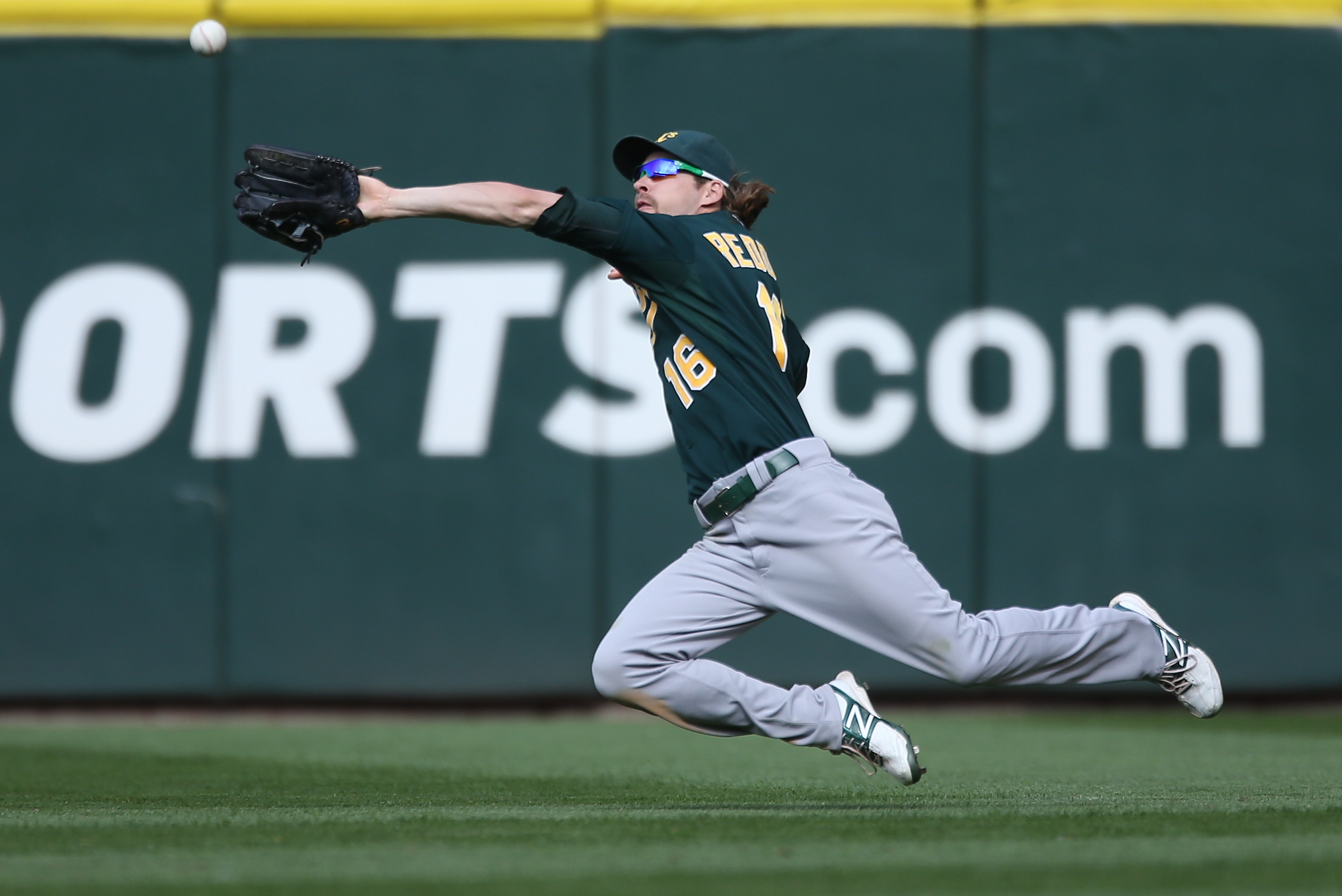 Josh Reddick keeps an eye on his old Oakland A's teammates