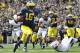 Denard Robinson (16).