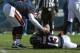 CHICAGO, IL - DECEMBER 18: Caleb Hanie #12 of the Chicago Bears checks on teammate Johnny Knox #13 after Knox was injured against the Seattle Seahawks at Soldier Field on December18, 2011 in Chicago, Illinois. The Seahawks defeated the Bears 38-14. (Photo by Jonathan Daniel/Getty Images)