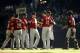 MILWAUKEE, WI - SEPTEMBER 30: Jordan Lyles #41 of the Houston Astros is congratulated by his teammates after getting the win against the Milwaukee Brewers at Miller Park on September 30, 2012 in Milwaukee, Wisconsin. The Astros defeated the Brewers 7 - 0.(Photo by Mark Hirsch/Getty Images)