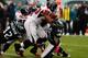 PHILADELPHIA, PA - OCTOBER 28: Running back Michael Turner #33 of the Atlanta Falcons is tackled by Kurt Coleman #42 and Akeem Jordan #56 of the Philadelphia Eagles during the first half at Lincoln Financial Field on October 28, 2012 in Philadelphia, Pennsylvania. (Photo by Rob Carr/Getty Images)