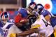 EAST RUTHERFORD, NJ - AUGUST 21: Andre Brown #22 of the New York Giants is tackled by Frank Summers #44 of the Pittsburgh Steelers during their preseason game at New Meadowlands Stadium on August 21, 2010 in East Rutherford, New Jersey. (Photo by Nick Laham/Getty Images)
