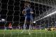 LONDON, ENGLAND - OCTOBER 31: David Luiz of Chelsea collects the ball from the net after scoring his penalty during the Capital One Cup Fourth Round match between Chelsea and Manchester United at Stamford Bridge on October 31, 2012 in London, England. (Photo by Clive Rose/Getty Images)
