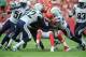 Sep 30, 2012; Kansas City, MO, USA; Kansas City Chiefs running back Jamaal Charles (25) is tackled by San Diego Chargers safety Eric Weddle (32) and linebacker Larry English (52) in the second half at Arrowhead Stadium. San Diego won the game 37-20. Mandatory Credit: John Rieger-US PRESSWIRE