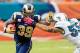 MIAMI GARDENS, FL - OCTOBER 14: (L) Steven Jackson #39 of the St. Louis Rams is tackled by (R) Koa Misi #55 of the Miami Dolphins at Sun Life Stadium on October 14, 2012 in Miami Gardens, Florida. (Photo by Chris Trotman/Getty Images)